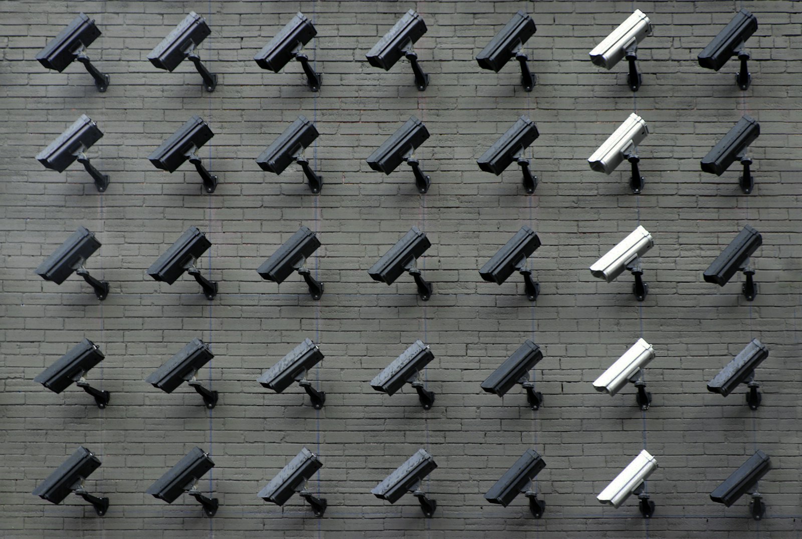 Modern office with discreet ceiling-mounted CCTV camera