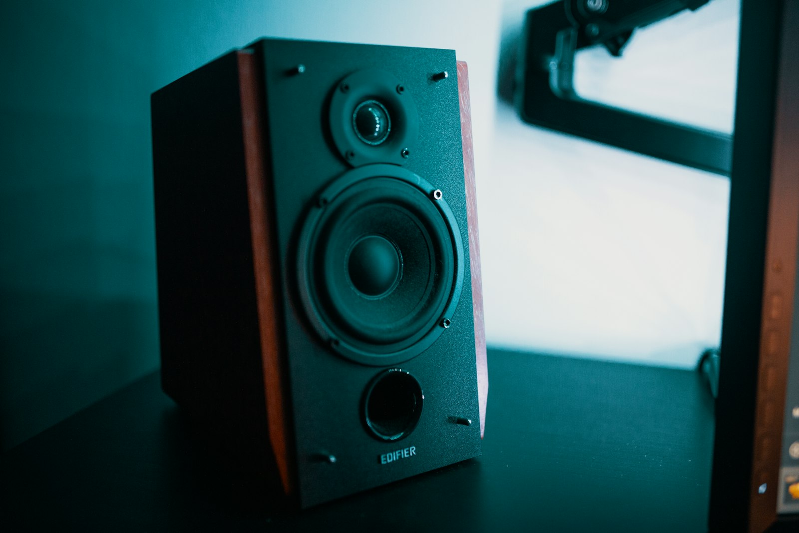 Ceiling-mounted public address speaker in modern building